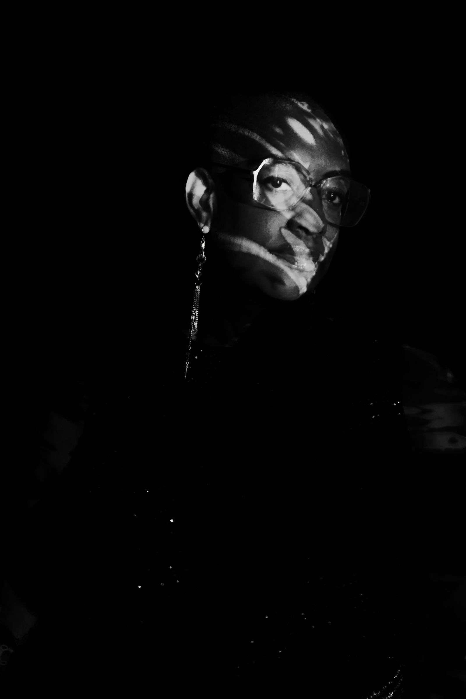 Sharlese in black and white with a cool dangly earring